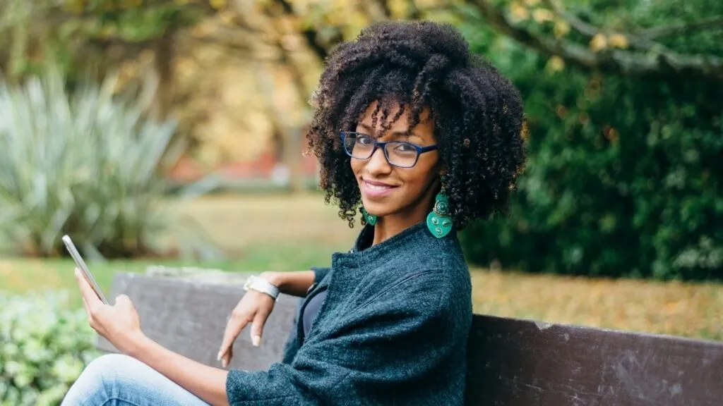 woman sitting on a bench in a park