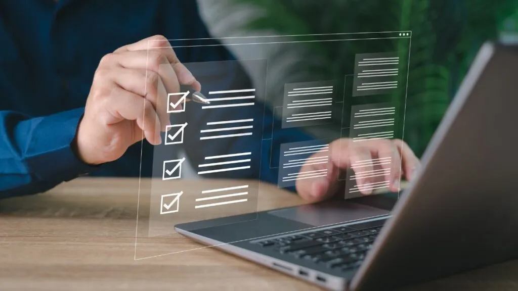 man holding a pen marking of a checklist